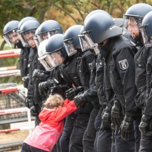 Police stopping a little girl?